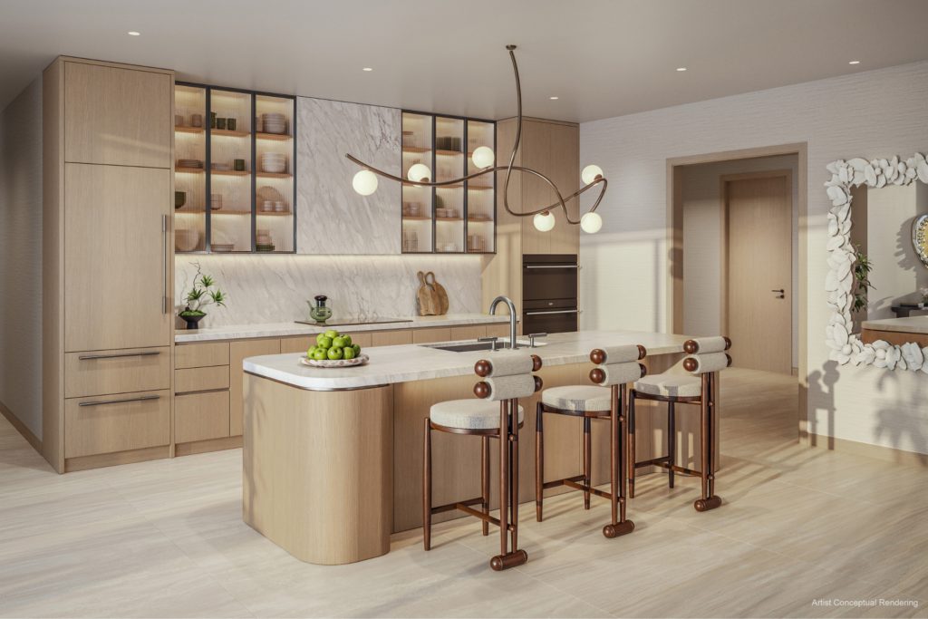 Kitchen: light oak cabinetry and marble countertops